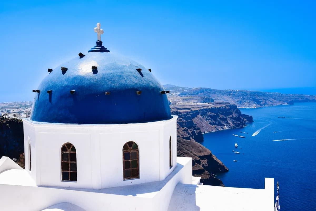 Blue-domed church above the Aegean, Cyclades, Greece